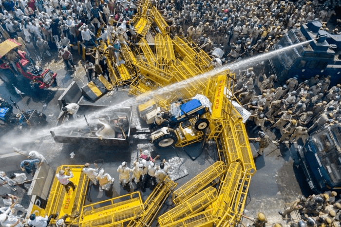 Police try to disperse farmers protesting on the edge of New Delhi