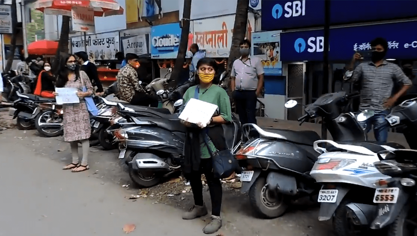 Activists protest outside an SBI branch in Pune